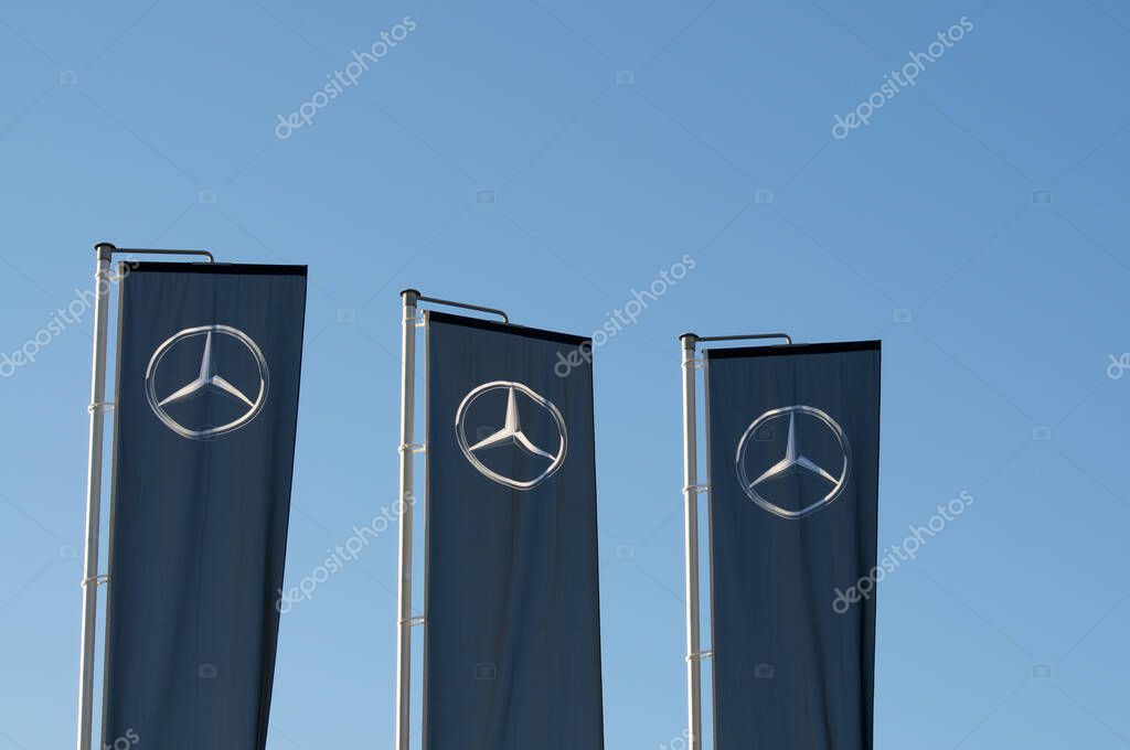 Vezia, Ticino, Switzerland - 7th October 2019 : View of three flags with the logo of Mercedes Benz located in Vezia, Switzerland