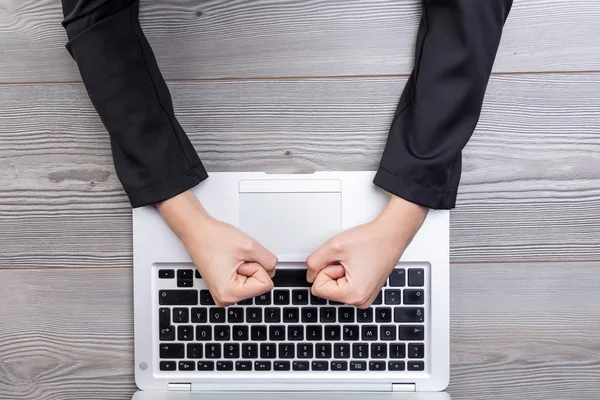 View Angry Clenched Fists Hitting Laptop Keyboard Wooden Table Background — Stock Photo, Image