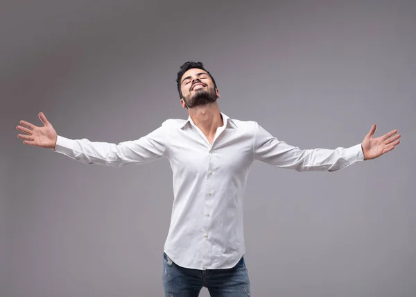 Portrait Young Bearded Man Wearing White Shirt Showing Relieved Gesture — Stock Photo, Image