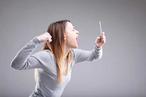 Single Angry Young Woman Attempts Punch Her Phone She Takes — Stock Photo, Image