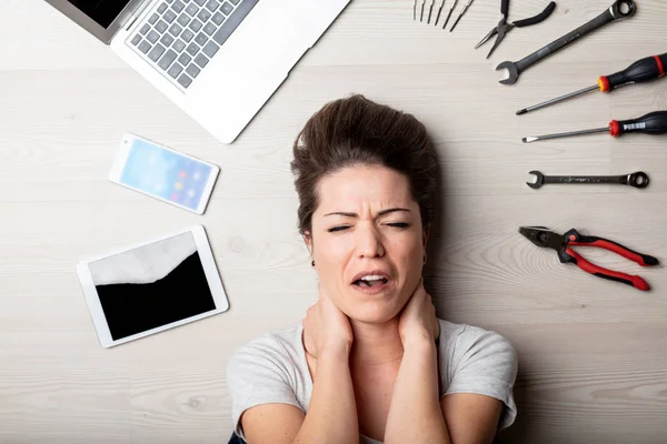 Stressed Woman Surrounded Assorted Hand Tools Her Laptop Tablet Mobile — Stock Photo, Image