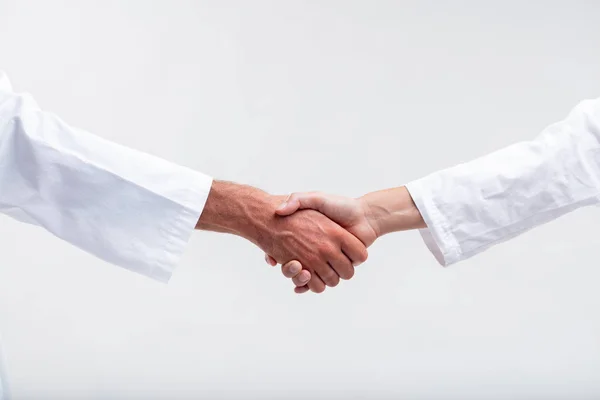 Two Medical Personnel Shaking Hands Man Woman Wearing White Lab — Stock Photo, Image