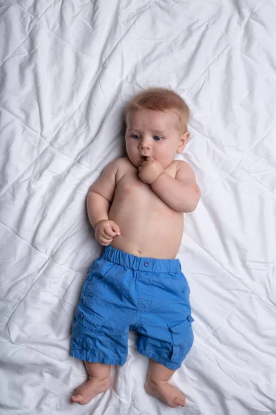 Thoughtful Contented Little Baby Boy Sized Blue Pants Lying His — Stock Photo, Image