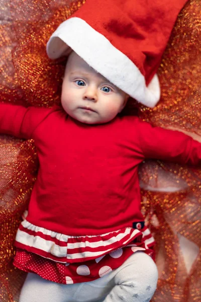 Little Baby Festive Red Santa Outfit Lying Gold Glitter Fabric — Stock Photo, Image
