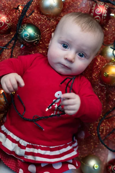 Little Baby Festive Red Christmas Outfit Lying Cot Surrounded Tinsel — Stock Photo, Image