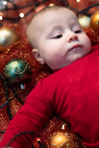 Cute Little Baby Colorful Christmas Baubles Lying Cot Glittering Red — Stock Photo, Image