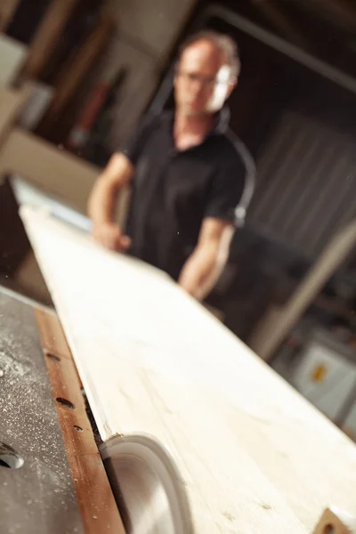 Carpenter or woodworking working in a workshop — Stock Photo, Image