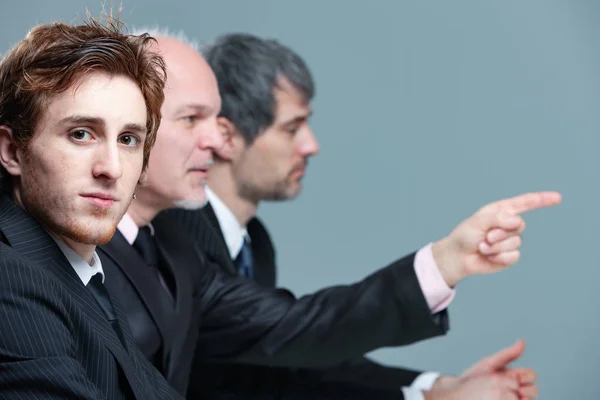 Serious young businessman in a meeting — Stock Photo, Image