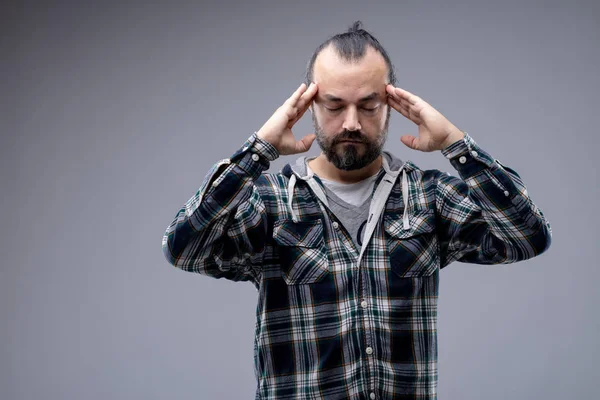 Man with a headache or concentrating — Stock Photo, Image