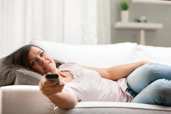 Long Haired Smiling Woman Choush Her Living Room Changing Channels — Stock Photo, Image