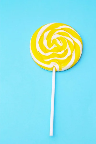 Yellow Lollipop Blue Background — Stock Photo, Image