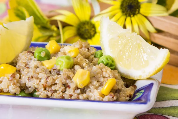 Spring quinoa salad with corn and peas