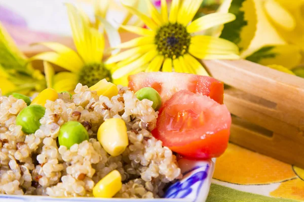 Spring quinoa salad with corn and tomato