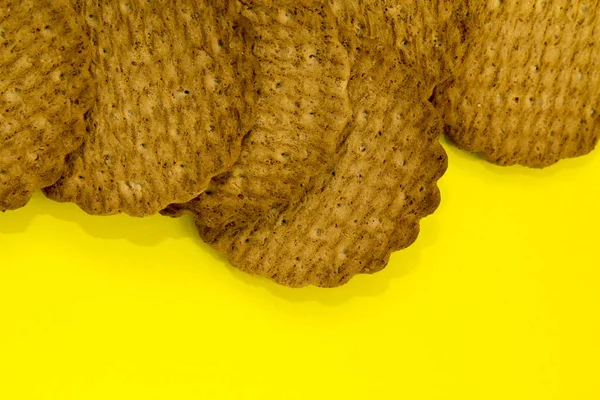 Wholemeal cookies on yellow background