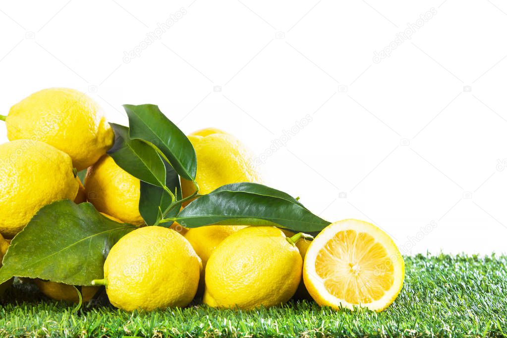 Lemon with leaves isolated on white background.
