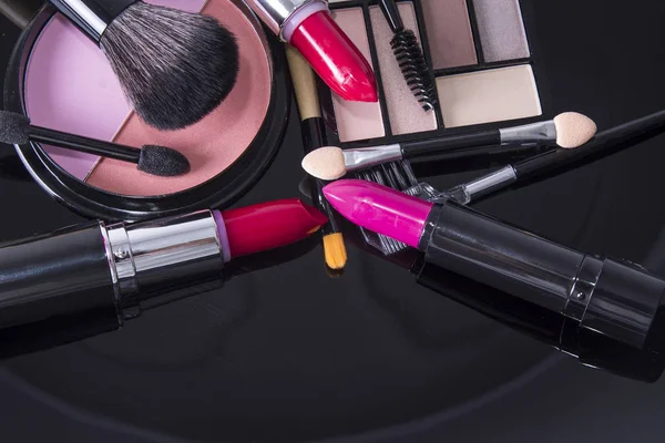 makeup accessories on colorful background