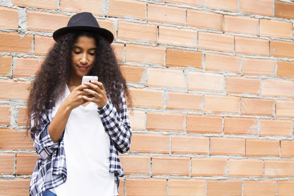 Afro Girl Hat Looking Her Cellphone — Stock Photo, Image