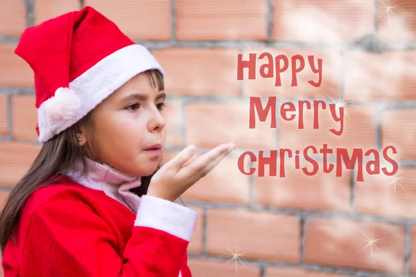小女孩穿得像桑塔吹雪一样 向圣诞节表示祝贺 — 图库照片