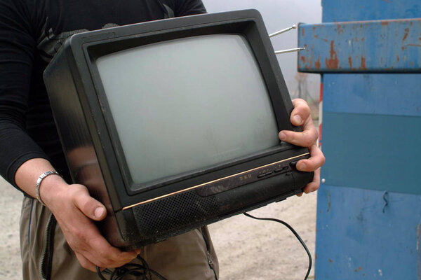 A old a TV properly disposed of in the waste for recycling
