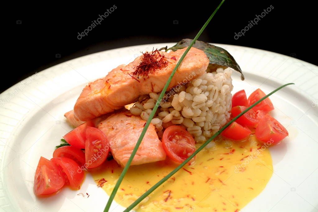 Italian food recipes, salmon with boiled barley and saffron sauce