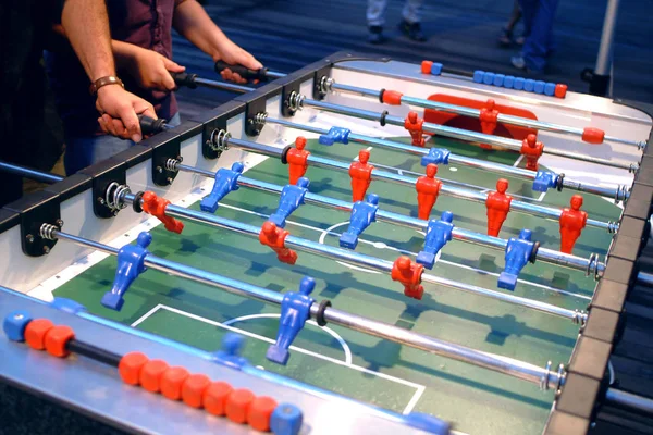 Players of table football (table soccer)