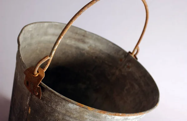 Antique rusty metal water bucket