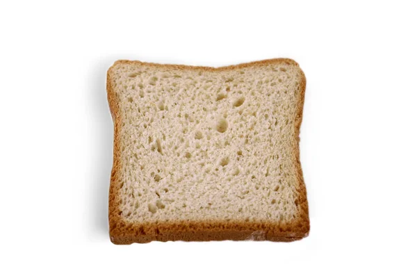 Jeden krajíc bílého chleba na světelně pozadí. — Stock fotografie