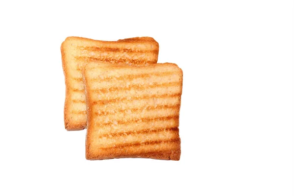 Dva zlaté plátky toastu chleba na bílém pozadí, izolované. Zobrazení zblízka, pohled shora — Stock fotografie