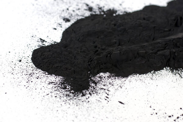 Scattered on a white sheet of black toner powder for digital printing for refilling the cartridge.