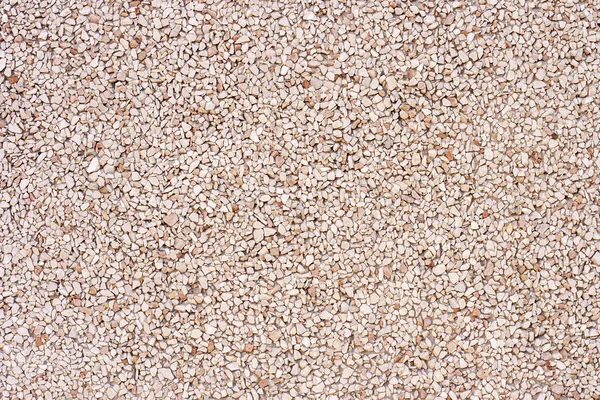 The texture of stone gravel, stone powder for facades. The concept of repair and exterior finish. Stock Photo