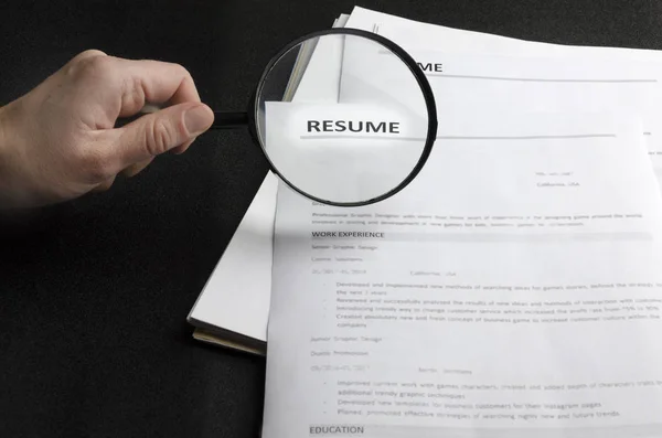 Lot Resume Applications Black Desk Holding Magnifying Glass Concept Searching Royalty Free Stock Photos