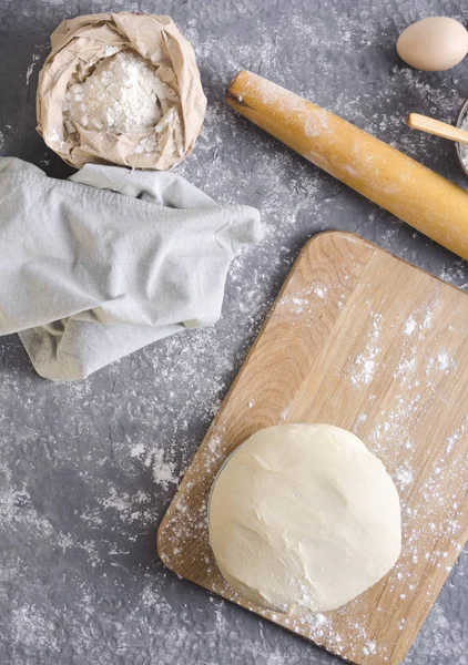 Wooden Rolling Pin Flour Paper Bag Eggs Napkin Risen Dough — стоковое фото