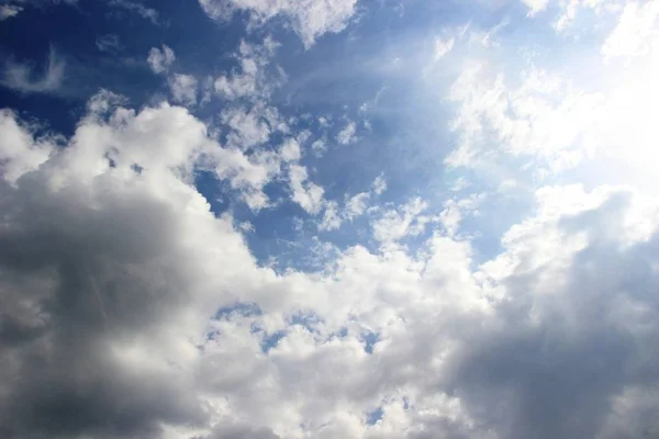 clouds in the spring sky, all shades of blue. running in the sun clouds in the blue sky immediately after the rain.
