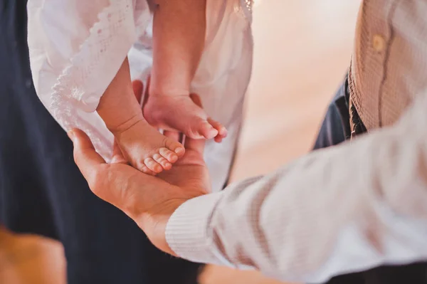 Priest Rubs Baby Feet — Stock Photo, Image