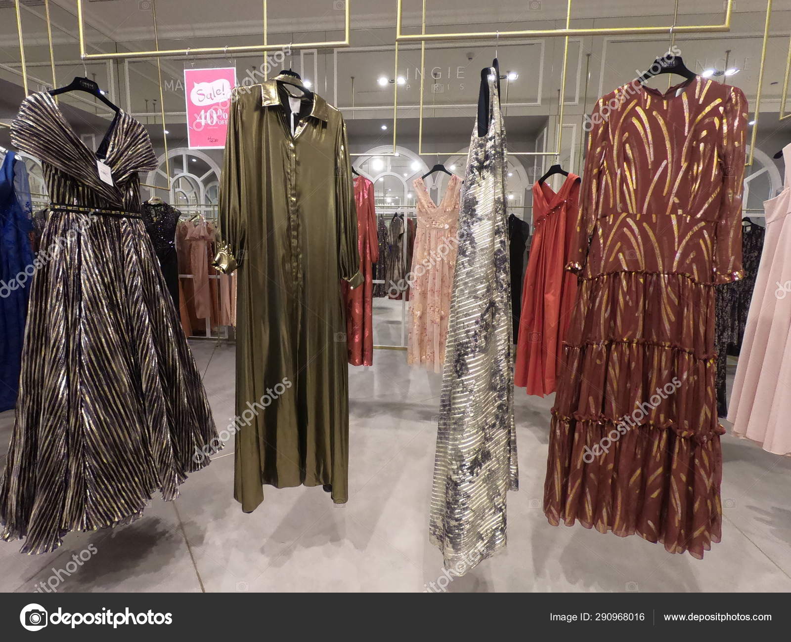 Dubai UAE - July 2019: Department of dresses in the women's clothing store.  A lot of female Evening Gowns, dresses displayed for sale on hangers in a  boutique clothing shop. – Stock