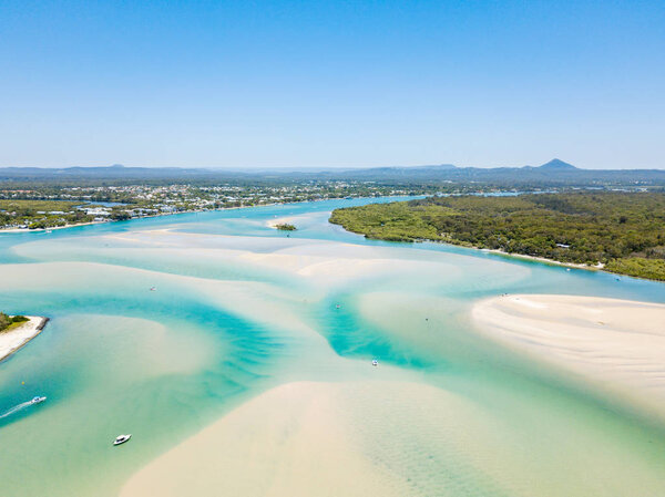 Noosa River and Noosa spit aerial view with vibrant blue water on the Sunshine Coast in Queensland, Australia
