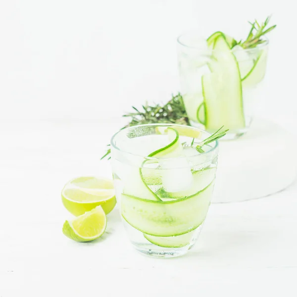 Fresh cucumber drink sprig of rosemary on a white background. Summer refreshing detox. Selective focus. — Stock Photo, Image