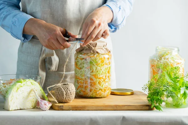 The preparation process fermentation preservation Sauerkraut on a light background. Natural rustic style. Canned food — Stock Photo, Image