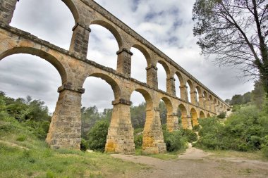 Ferreres Aqueduct, also known as the Pont del Diable, a Roman aqueduct built to supply water to the ancient city of Tarraco, today Tarragona in Catalonia, Spain. clipart