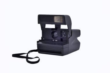 Vintage instant printing camera. Isolated object on white background. It's a collectible. Illustrative editorial.