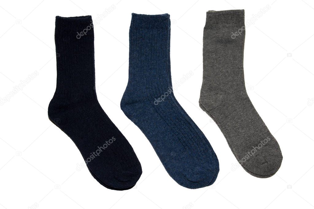 Three pairs of socks. Socks made of natural wool. Warm socks. Three pairs of colorful socks. On white background. Isolated.