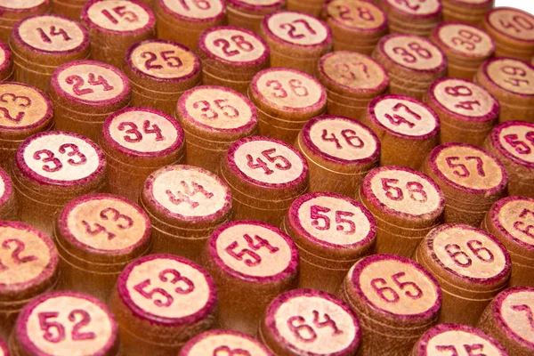 Wooden kegs for a game in a lotto with red numbers. Gambling. Vintage barrels Bingo Board game. Close up.