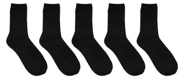 Набор черных носков изолирован на белом фоне. Теплые шерстяные носки — стоковое фото