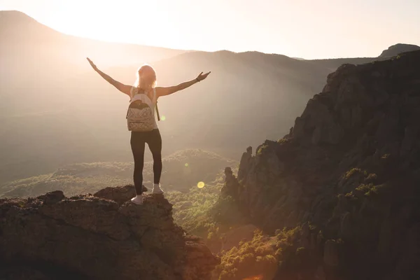 Beautiful woman on the top of mountain