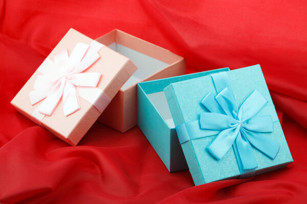 Two boxes with presents on the red background for celebration, Birthday