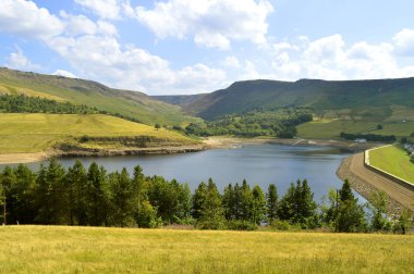 Dovestone Reservoir lies at the convergence of the valleys of the Greenfield and Chew Brooks above the village of Greenfield, on Saddleworth Moor in Greater Manchester clipart