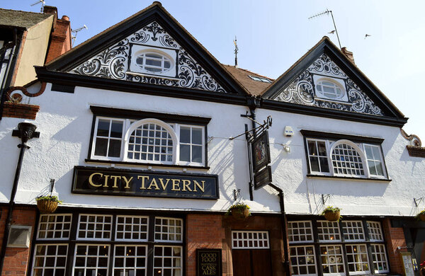 Chester, England, UK, Europe - April 19, 2019 : Tudor style black and white timber frame tavern in Chester City centre