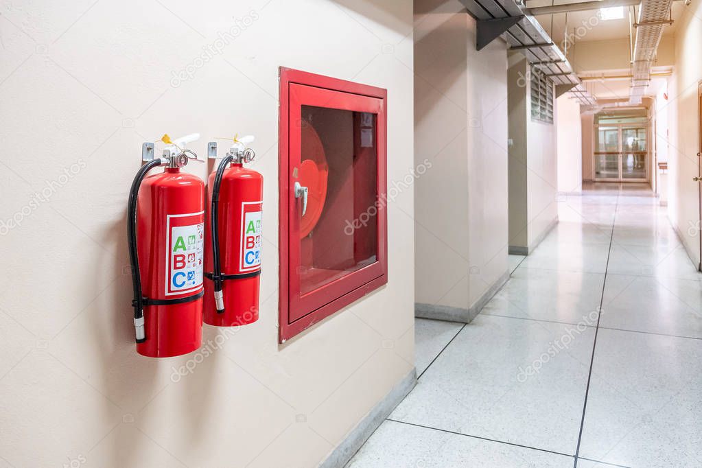 Fire extinguisher system on the wall background, powerful emerge