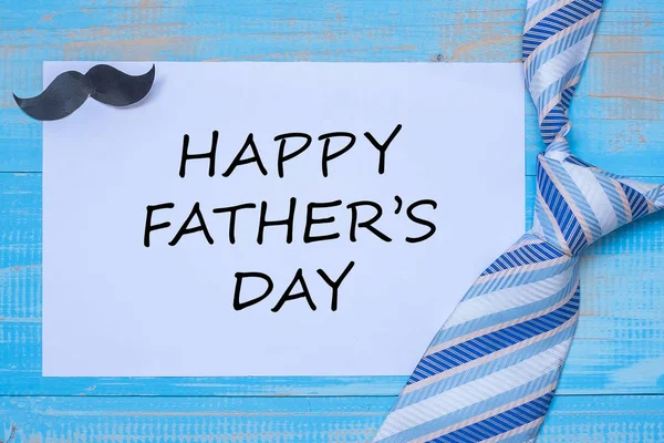 Happy Father's Day with blue neckties and mustache on wooden bac — Stock Photo, Image