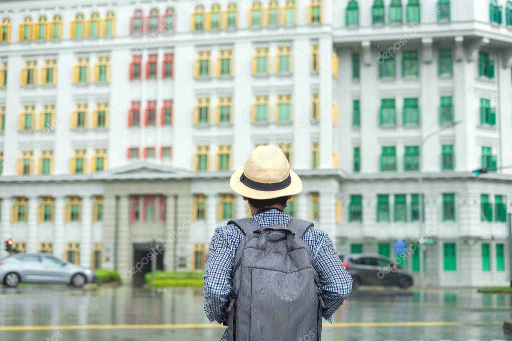 Young man traveling with hat, Solo Asian traveler visit at rainb